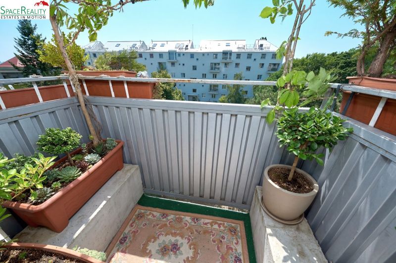 Balcony of a 2-room apartment with plants on Kyjevská Street, Bratislava - Nové Mesto.