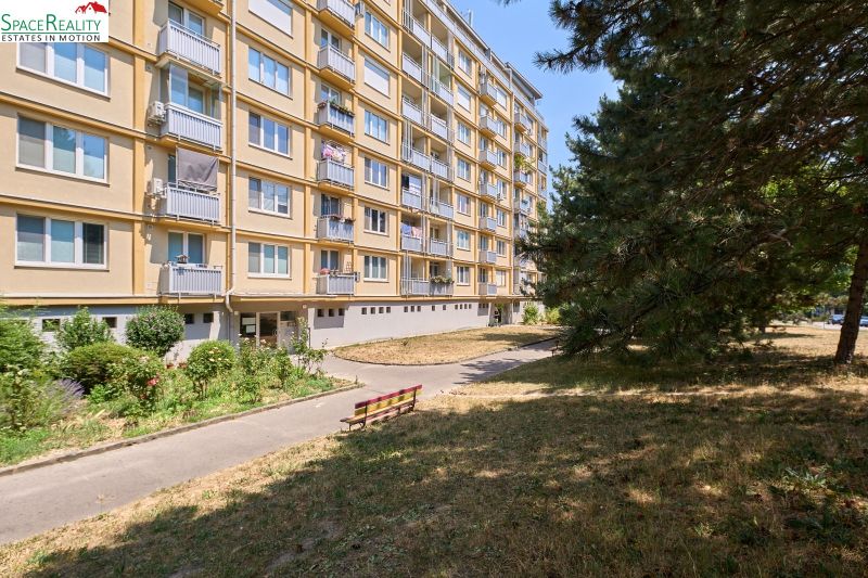 Apartment building on Kyjevska Street in Bratislava - Nové Mesto, surrounded by greenery and trees.