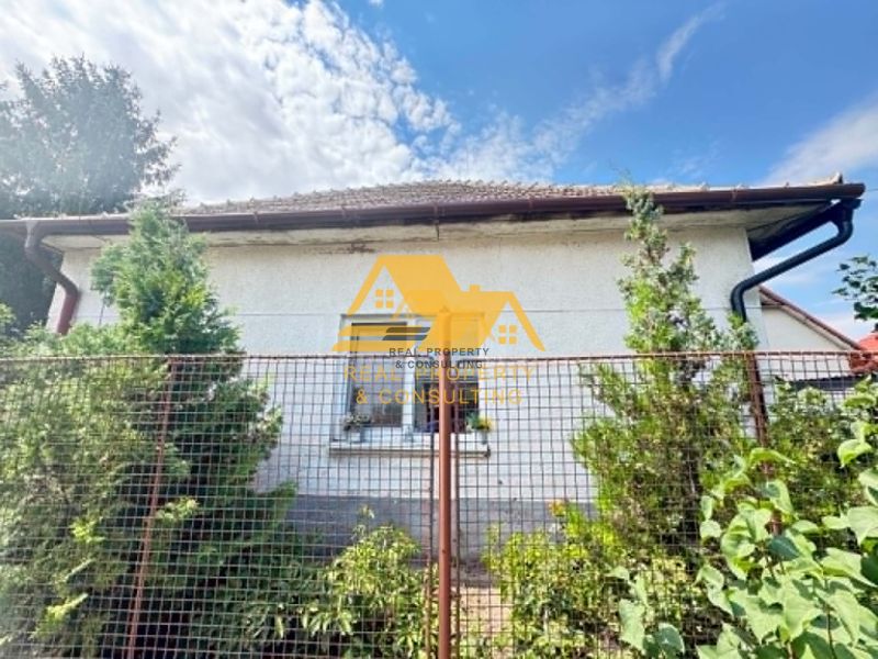 Family house in Imeľ on Imeľ Street, fencing and greenery.