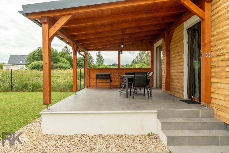 Terrace of a 4-room apartment on Vodárenská Street in Nová Lesná with a wooden shelter.