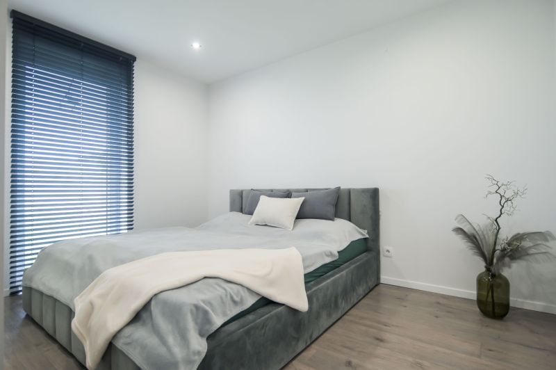 Bright bedroom with a bed and decoration in a family house, floor with wood decor.