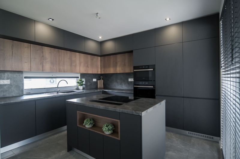 A kitchen with an island and a wooden decor floor in a family house.