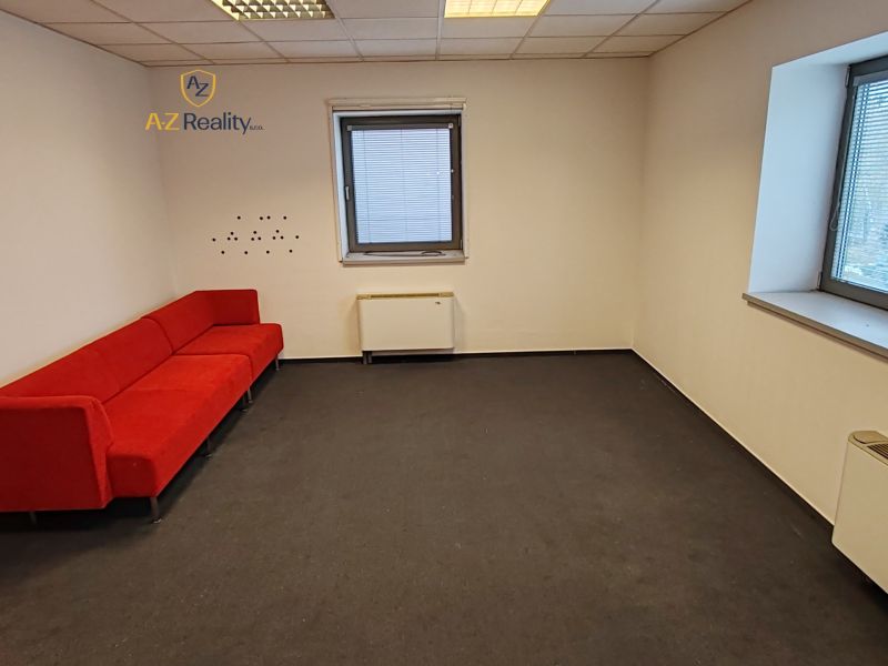 Office with a red sofa, gray carpet, two windows, Záhradnícka, Komárno.