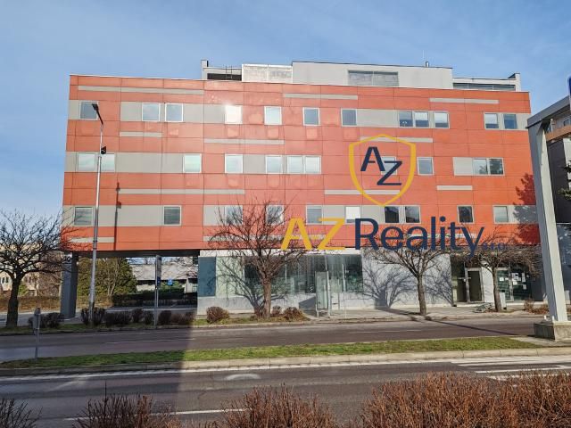 Office building on Záhradnícka Street in Komárno, with a sidewalk in front of it.