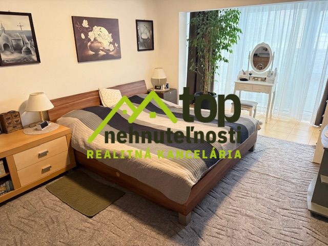 Bedroom with a bed, carpets, and decorations, Family house.