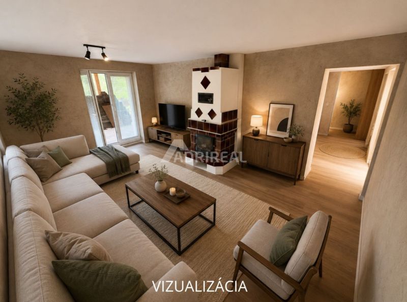 Living room in a family house with a fireplace and wood-patterned flooring, light-colored seating.