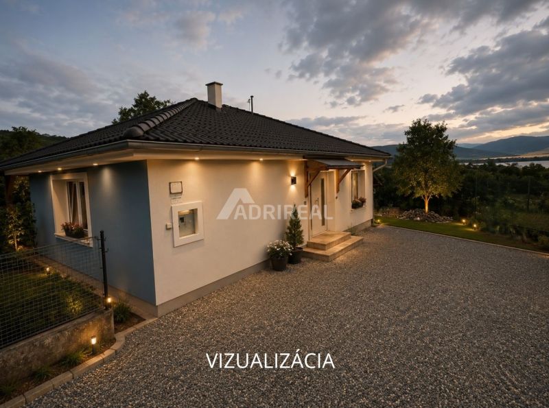 A family house in Ružiná with a landscaped garden and a view of the surrounding nature.