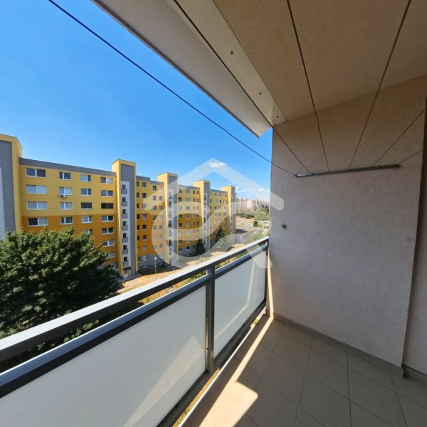 The balcony of a 3-room apartment on Dunajská Street in Nitra, Klokočina with a view of the panel buildings.