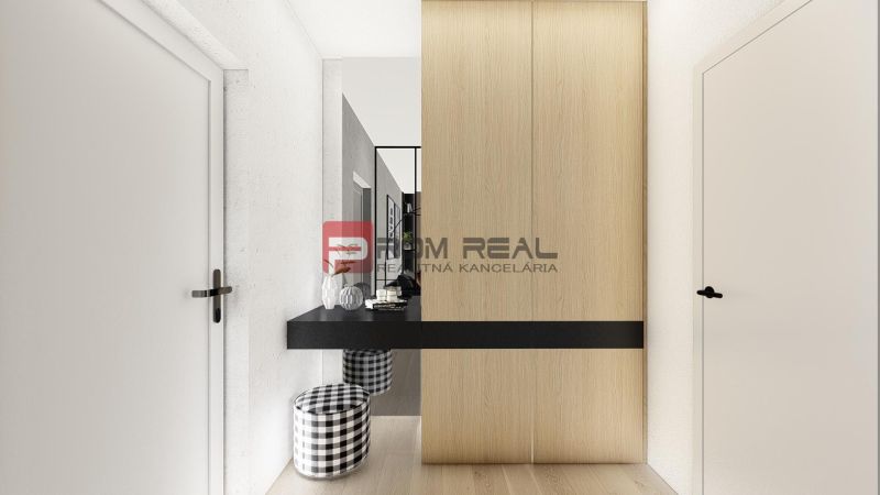 A hallway in a two-room apartment with a wood-patterned floor and a wardrobe.