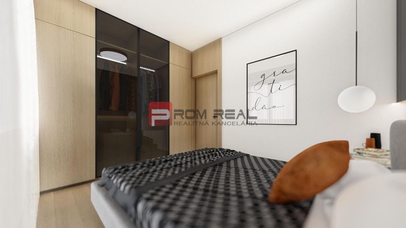 Bedroom in a 2-room apartment with a wood-patterned floor and a built-in wardrobe.