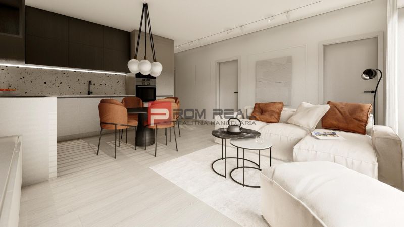 Living room in a 3-room apartment with a cream sofa and a kitchen with dark cabinets.