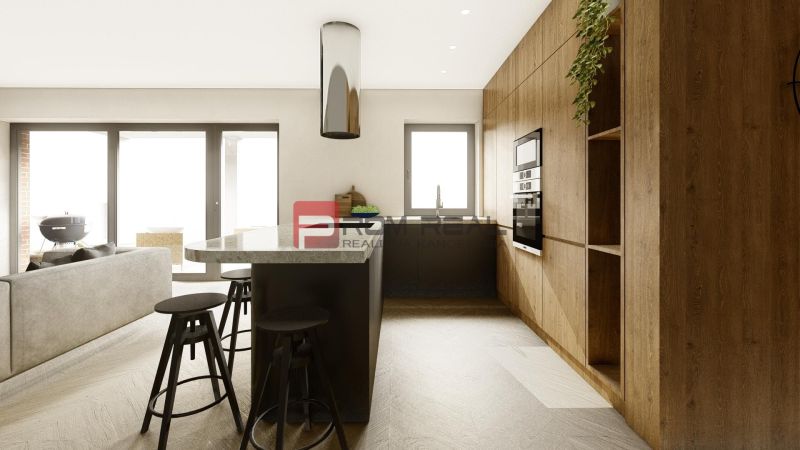 A kitchen in a 4-room apartment with a wooden decor floor and a central island.
