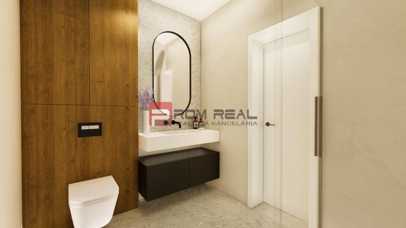 Bathroom in a 4-room apartment with a wall-mounted toilet, mirror, and floor with wood decor.