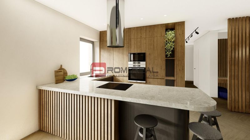 A kitchen in a 4-room apartment with a wooden decor and a stylish island.