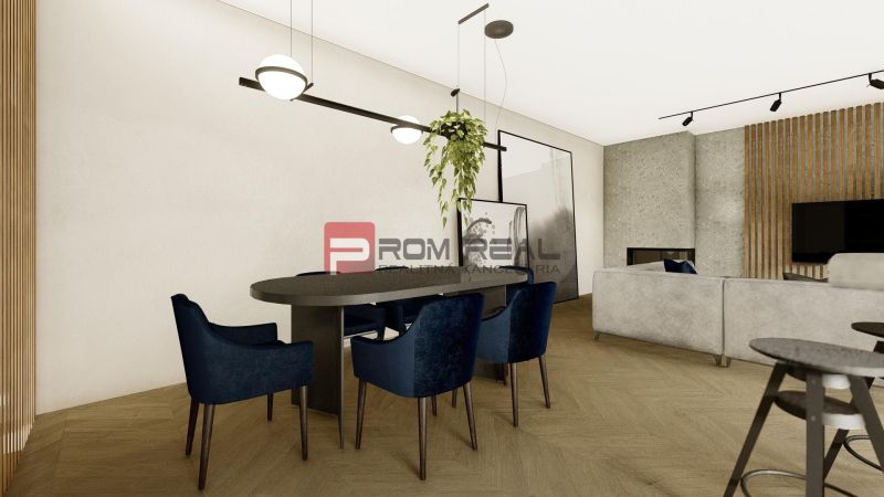 Dining area with blue chairs and wood-patterned flooring in a 4-room apartment.