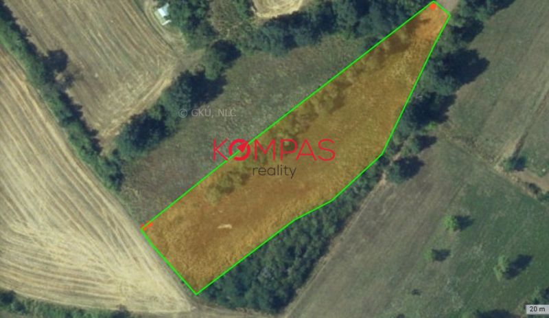 Aerial view of agricultural and forest land near Krupina with green borders.