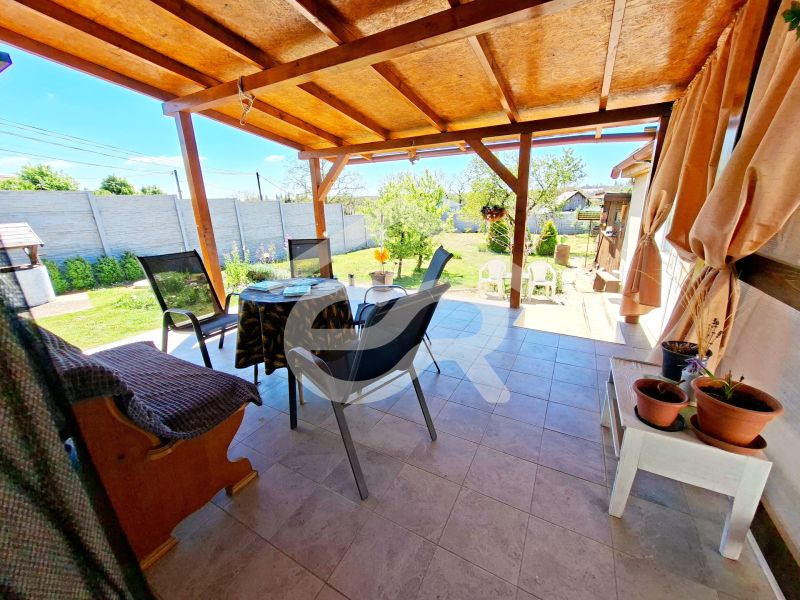The terrace of a family house in Jasová with a view of the garden and comfortable seating.