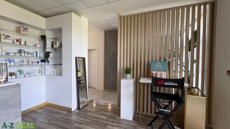 Commercial premises with a wooden decor floor, shelves, and cosmetic products.
