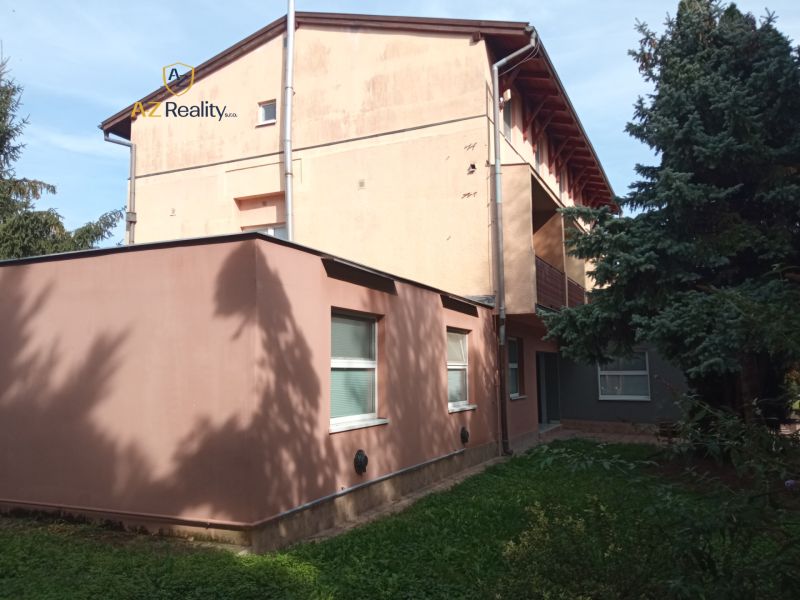 A building among trees in Patince, suitable for hotels and guesthouses.
