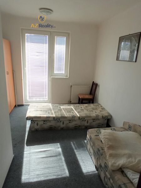 A simple room in hotels and guesthouses with a window and two beds.