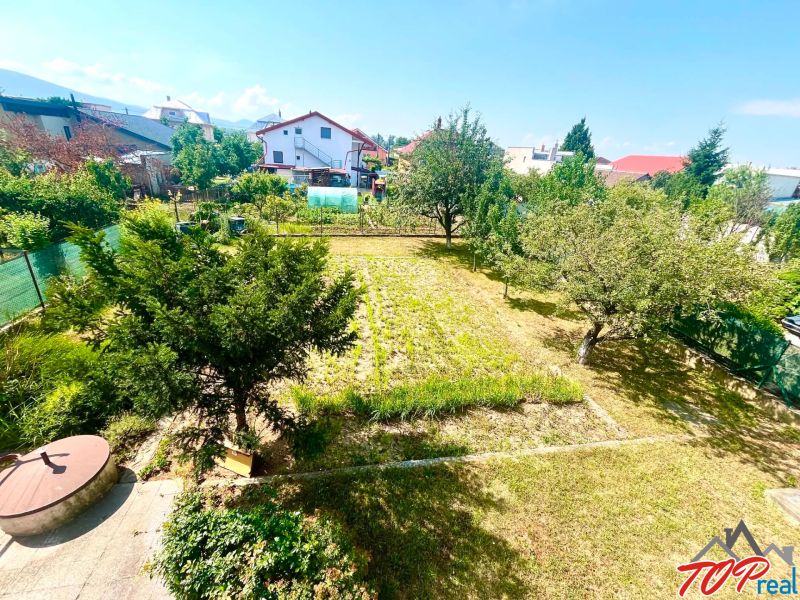 The garden at the family house on Agátová Street in Čaňa with fruit trees and flower beds.