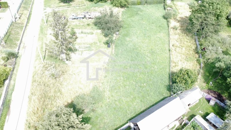 Aerial view of a green plot in Vlachovo, suitable for living.