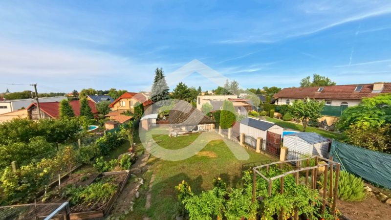 Gardens of family houses on Hlavná Street in Lehota with plenty of greenery.
