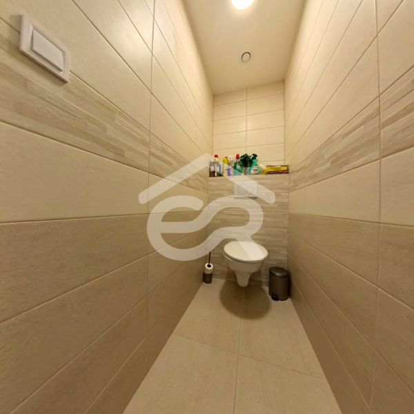 Bathroom with toilet and tiles in a 3-room apartment.
