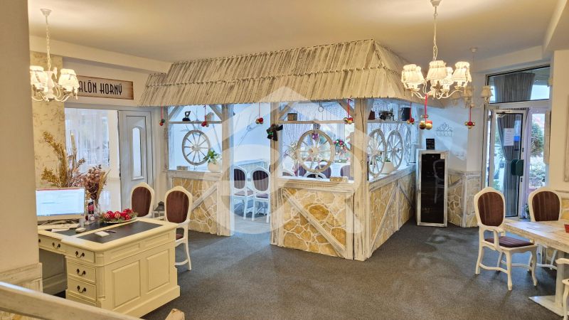 Hotel interior with decorative elements, vaulted ceilings, and ambient lighting.