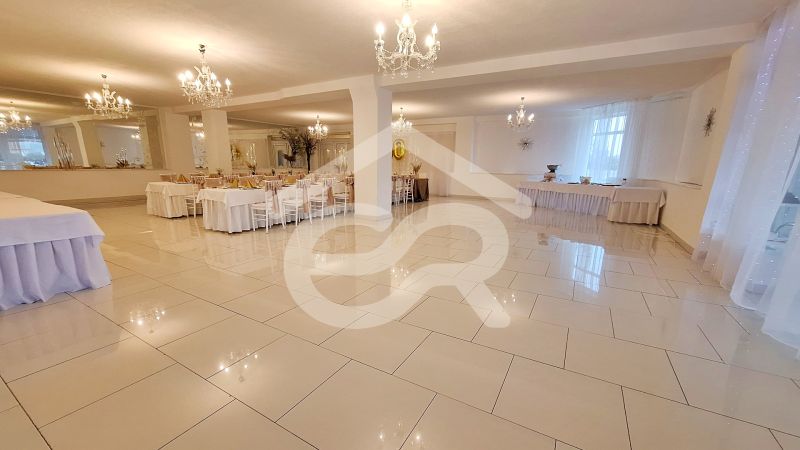 Luxury hall with white tiles and crystal chandeliers in hotels and guesthouses.