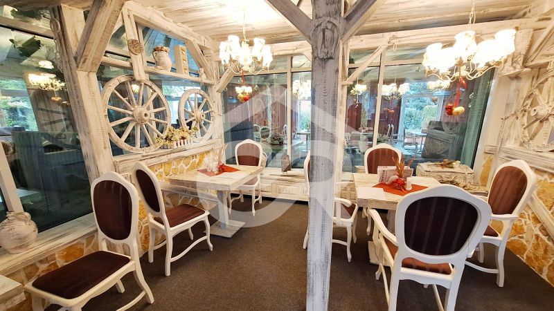 Traditional interior of hotels and guesthouses with chandeliers and rustic decor.