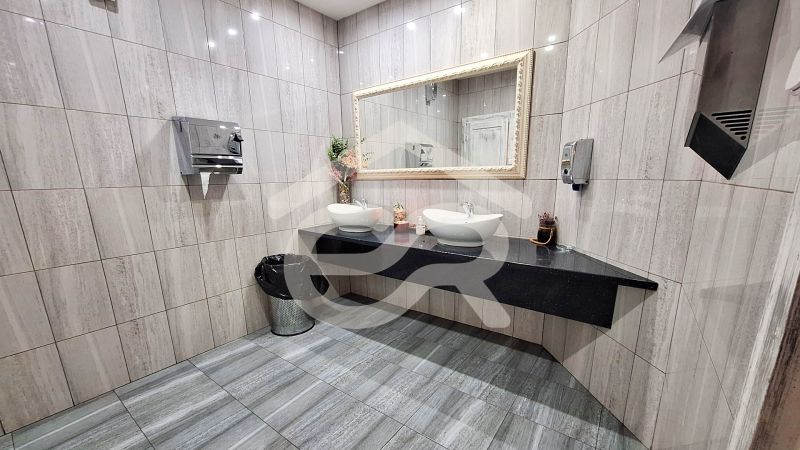 A bathroom with two sinks and a large mirror in hotels and guesthouses.