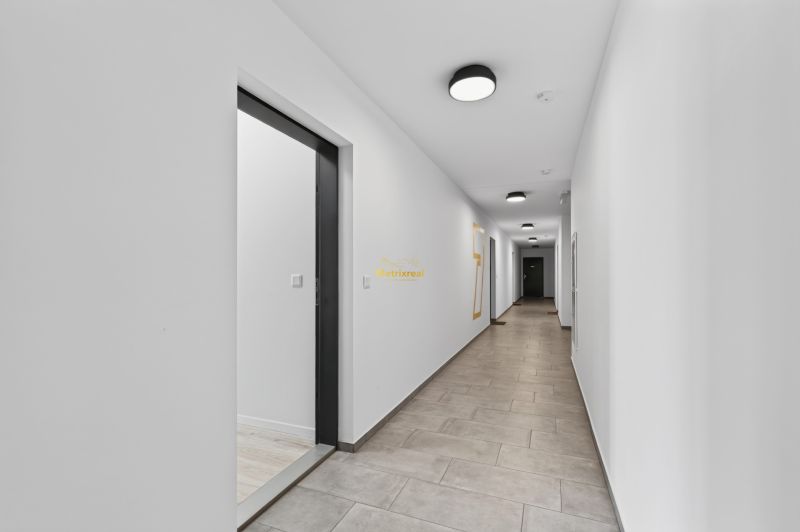 The hallway of an apartment building with white walls on Labutia Street in Bratislava, Petržalka.