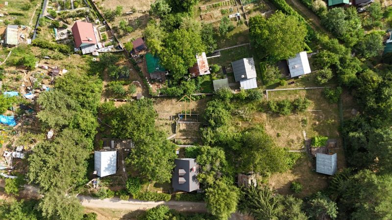 Aerial view of the arrangement of cottages in the green landscape near Banská Bystrica.