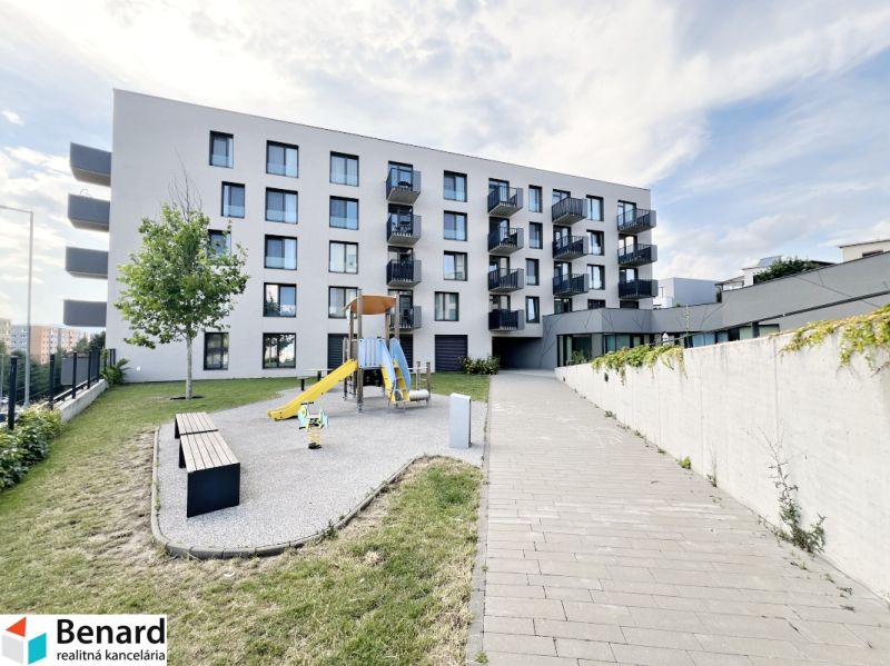Apartment building on Sibírska Street in Prešov with a children's playground and benches.