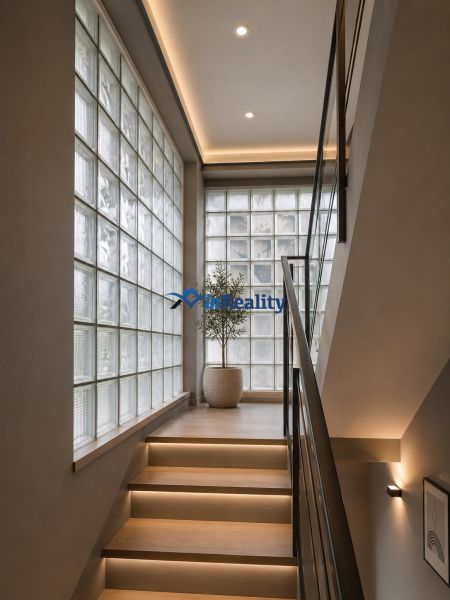 Staircase illuminated with LED strips, glass blocks, flowers in a family house.