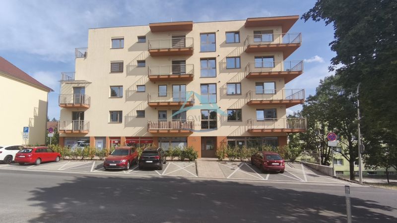 Apartment building on Okružná Street in Veľký Krtíš with parking spaces.