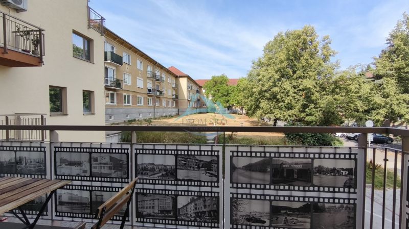 A balcony with a view of the greenery surrounding the 2-room apartment on Okružná Street, Veľký Krtíš.