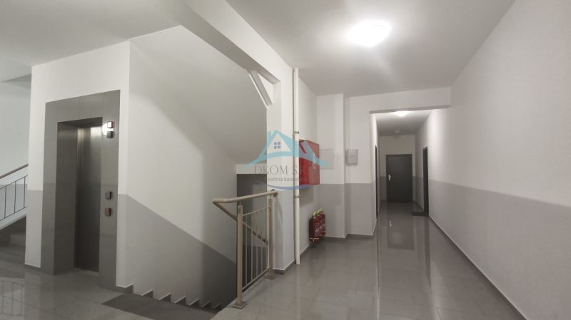 Hallway with elevator and staircase, Okružná Street, Veľký Krtíš, near a 2-room apartment.