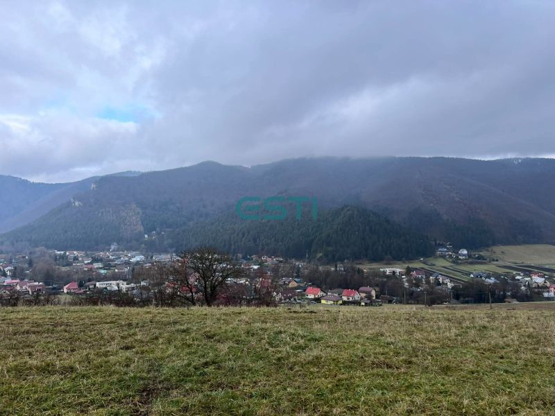 Panorama of agricultural and forest lands in Stránske with a view of the mountains and the village.