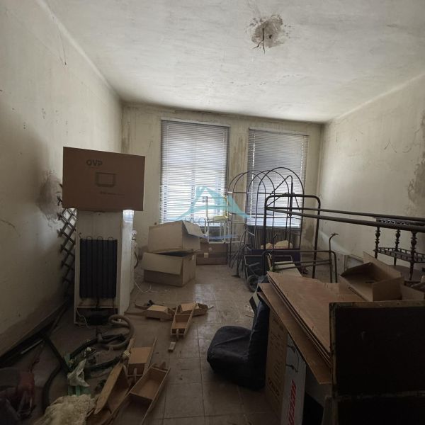 Unfurnished commercial spaces with cardboard boxes and metal furniture.