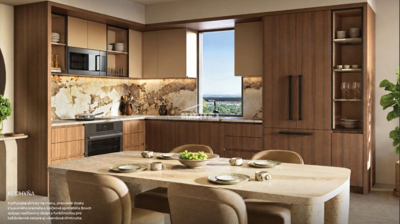 A kitchen unit with marble cladding and a table in a studio apartment.