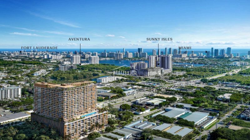 Panorama of Miami with skyscrapers and greenery around studio apartments.