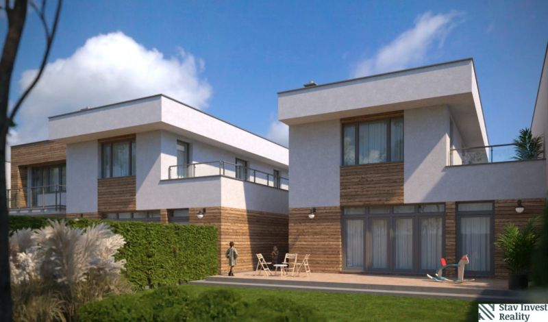 Family houses on Lužianska Street in Senec, bright facades, terrace with seating and plants.