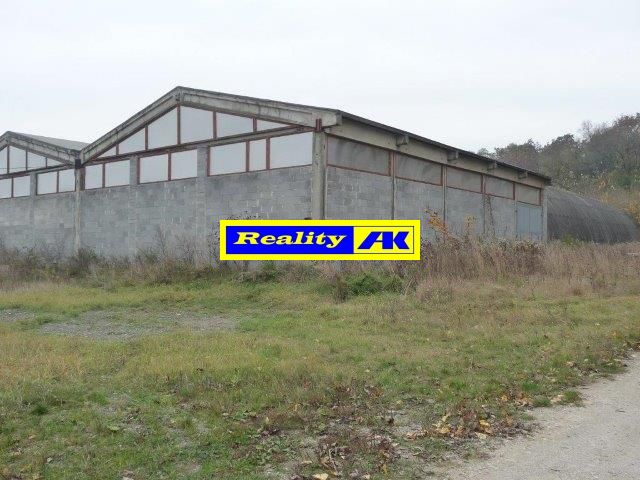 The exterior of warehouses and halls in Trnava, surrounded by a natural environment.