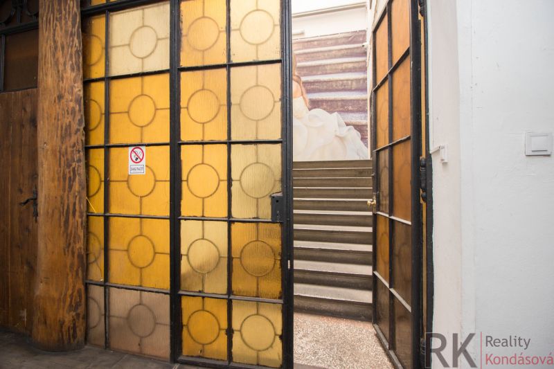 Glass doors leading to the staircase in commercial premises with a historical feel.