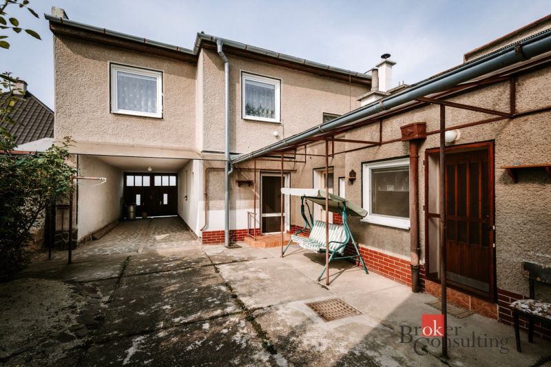 The exterior of a family house in Radzovce with a covered entrance and an adjacent terrace.