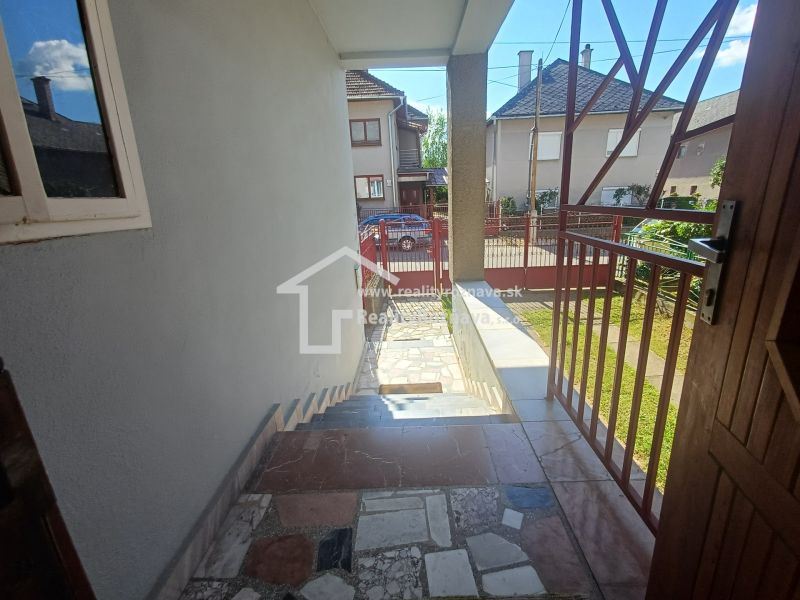 Entrance hall of a family house in Rožňava with a view of the street and garden.