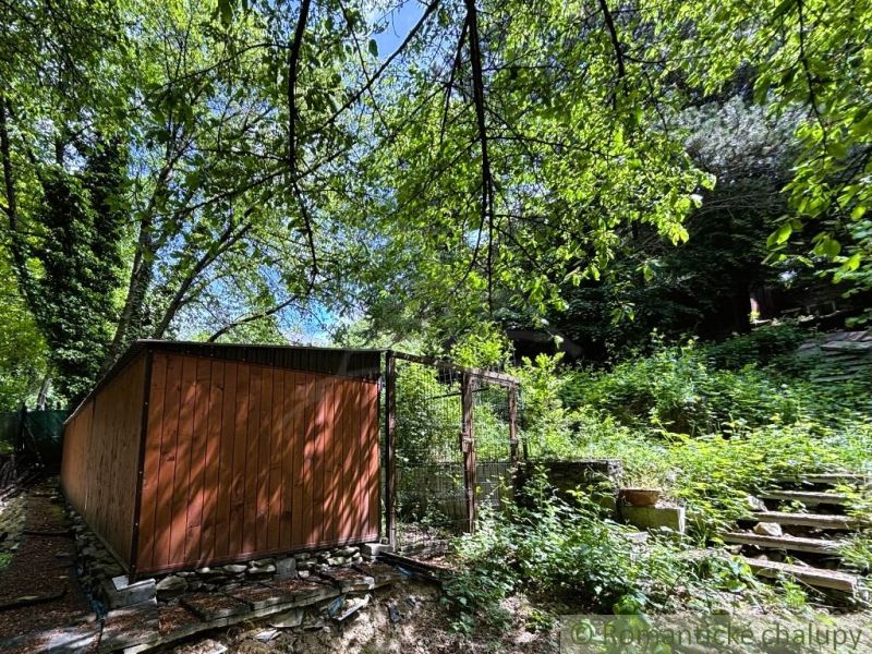 A wooden cabin in nature with rich vegetation in Bratislava IV.