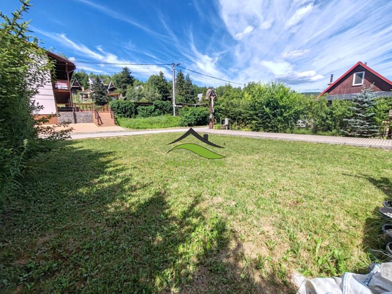 Recreational plots in Bžany at Valkov with grassy areas and surrounding greenery.